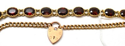 Lot 86 - A 9ct gold garnet bracelet and a curb and lock bracelet