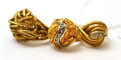 Lot 87 - A 9ct gold textured ring and two stone set rings each stamped 'K14' (3)