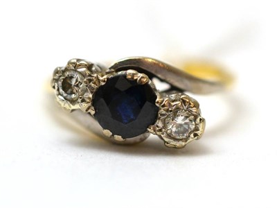 Lot 94 - A sapphire and diamond three stone ring