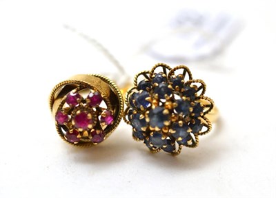 Lot 102 - A sapphire cluster ring and a ruby cluster ring (2)