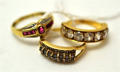 Lot 104 - A 9ct gold ruby and diamond ring, an 18ct gold half hoop ring and a 9ct gold half hoop ring (3)