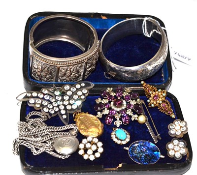 Lot 110 - A silver bangle, another bangle (possibly Indian), a locket on chain and assorted costume jewellery