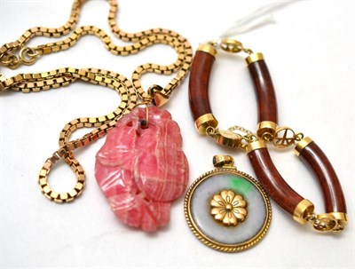 Lot 124 - A 14ct gold bracelet, a jade pendant and a pink hardstone pendant on chain