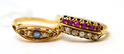 Lot 134 - An 18ct gold ruby and diamond two row ring and a sapphire and diamond ring (2)