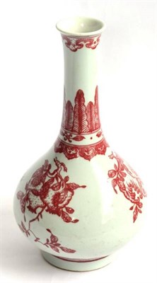 Lot 61 - A Chinese Porcelain Bottle Vase, painted in underglaze red with finger citron and pomegranates...