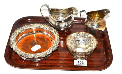 Lot 153 - Two Georgian silver jugs, silver bowl and a bottle coaster