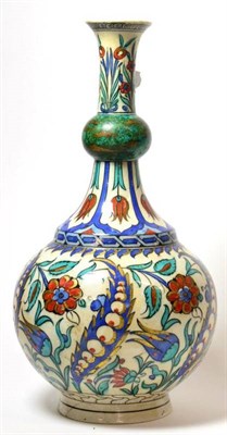 Lot 70 - An Isnik Style Pottery Guglet, late 19th century, with garlic neck, painted in colours with...