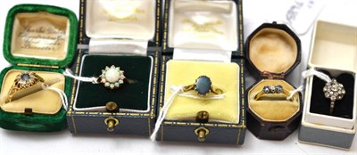 Lot 198 - Opal cluster ring, stamped '9CT', an opal triplet ring, a diamond and sapphire ring three stone...