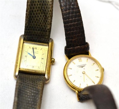 Lot 200 - A lady's 18ct gold wristwatch, signed Longines, quartz movement, textured dial with applied...