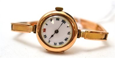 Lot 203 - A lady's 9ct gold wristwatch, signed Rolex, on a yellow metal bracelet stamped ";9c"; (cased)