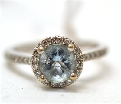 Lot 207 - An 18ct gold aquamarine and diamond cluster ring