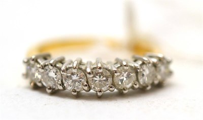 Lot 226 - Seven stone diamond ring, the uniform row of round brilliant cut diamond clan set in white gold...