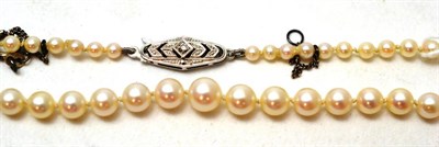 Lot 235 - A pearl necklace with a gold and diamond clasp