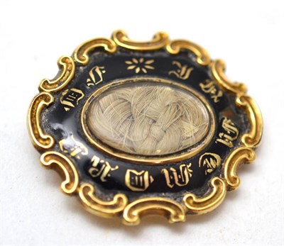 Lot 239 - A mourning brooch, inscribed to the reverse Jane * ob Jany 18 1857 at 27 (enamel a.f.),...