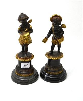 Lot 250 - A pair of cherub bronzes