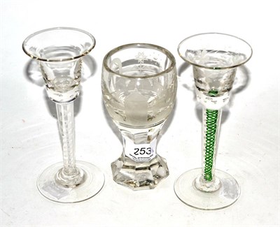 Lot 253 - A Masonic engraved toasting glass and two wine glasses with twist stems (3)