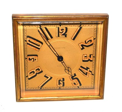 Lot 258 - A gilt brass desk timepiece, retailed by Asprey & Co, circa 1930, square shaped strut case,...