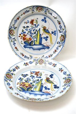 Lot 283 - A pair of 18th century tin glazed chargers