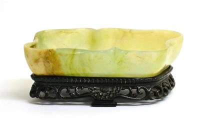 Lot 83 - A Chinese Jade Brush Washer, of lobed rectangular form, 20cm long, on hardwood stand