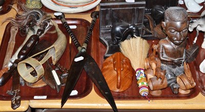 Lot 295 - An early 20th century carved ivory elephant bridge and two trays of African wooden tribal carvings