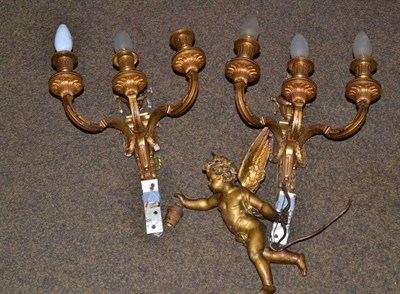 Lot 320 - A pair of three branch gilt metal wall lights and a cherub