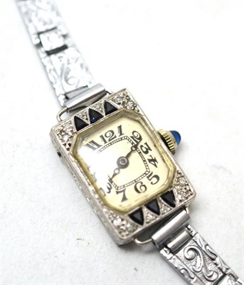 Lot 357 - A lady's diamond and sapphire set wristwatch, white metal case