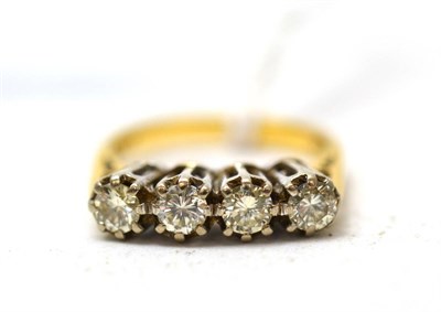 Lot 364 - An 18ct gold four stone diamond ring