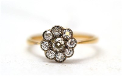 Lot 366 - An 18ct gold and diamond cluster ring of flowerhead form