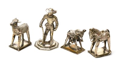 Lot 370 - Four white metal figures comprising a medieval gentleman, two donkeys and a calf, possibly...