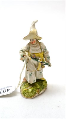 Lot 403 - A Frankenthal type porcelain figure, after a model attributed to Luck, as a woman wearing a...