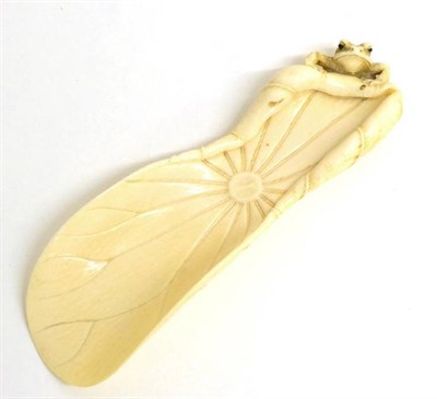 Lot 102 - A Japanese Carved Ivory Brush Rest, Meiji period, as a lily pad with a toad clambering over the...