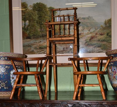 Lot 439 - Late Victorian faux bamboo dolls high chair and pair of dolls bow back armchairs (3)