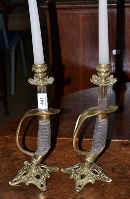 Lot 441 - A pair of Continental sabre hilts mounted as candlesticks