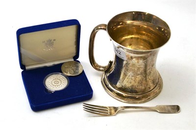 Lot 442 - Presentation silver mug and fiddle pattern fork and two £5 coins