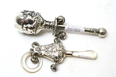 Lot 448 - A silver and mother-of-pearl rattle and a white metal Humpty Dumpty rattle