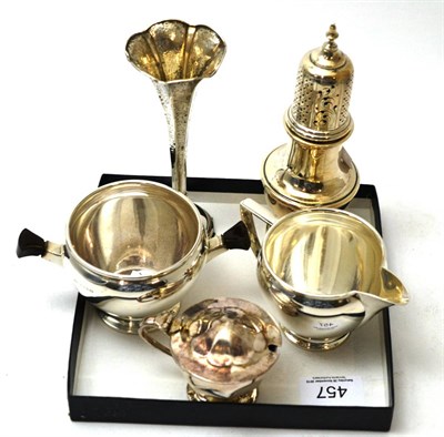 Lot 457 - A group of silver including Art Deco style cream jug and sugar bowl, bud vase, sugar caster and...