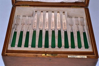 Lot 464 - A set of twenty four Art Deco silver bladed cake knives and forks (one fork missing), Mappin &...