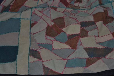 Lot 467 - Early 20th century wool crazy patchwork cover, with pink and blue embroidered edging, black...