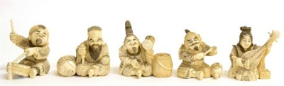 Lot 107 - A Set of Five Japanese Ivory Okimonos of Musicians, Meiji period, each seated playing a variety...