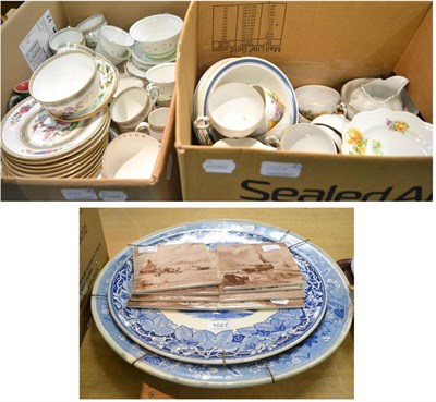 Lot 1027 - Two boxes of ceramics containing three tea sets etc, together with two blue and white chargers...