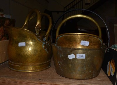 Lot 1039 - A brass preserve pan and three brass coal scuttles