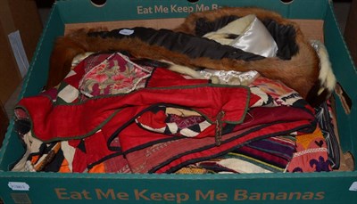 Lot 1047 - Ermine stole and another, a velvet striped Turkish waistcoat, another with gilt thread...