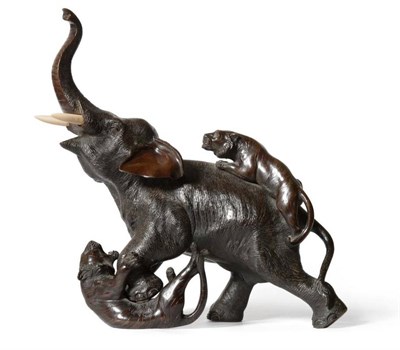 Lot 113 - A Japanese Bronze Okimono, Meiji period, as an elephant being attacked by two tigers, ivory...
