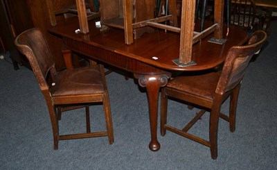 Lot 1085 - A set of six leather upholstered oak chairs and a mahogany dining table