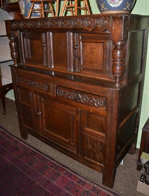 Lot 1292 - An 18th century carved oak court cupboard