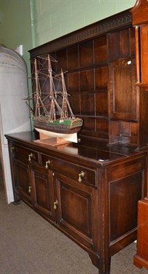 Lot 1311 - A 20th century oak dresser and rack