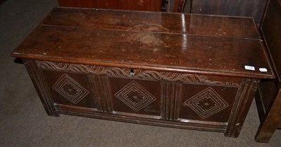 Lot 1336 - An oak coffer, the panels carved with lozenges