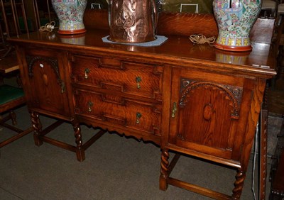 Lot 1338 - Reproduction oak sideboard together with a matching rectangular mirror