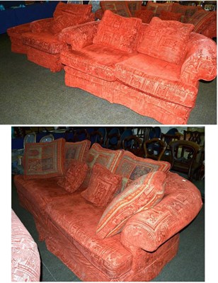 Lot 1360 - A red upholstered three piece suite comprising four seater sofa, two seater sofa, armchair and...