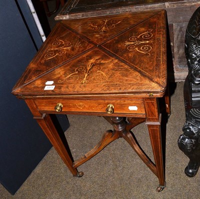 Lot 1373 - Victorian rosewood envelope top card table with boxwood stringing